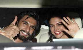 Ranveer  is carrying his lady love’s bag for her
