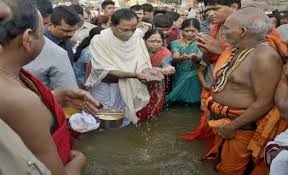KCR takes holy dip at Dharmapuri